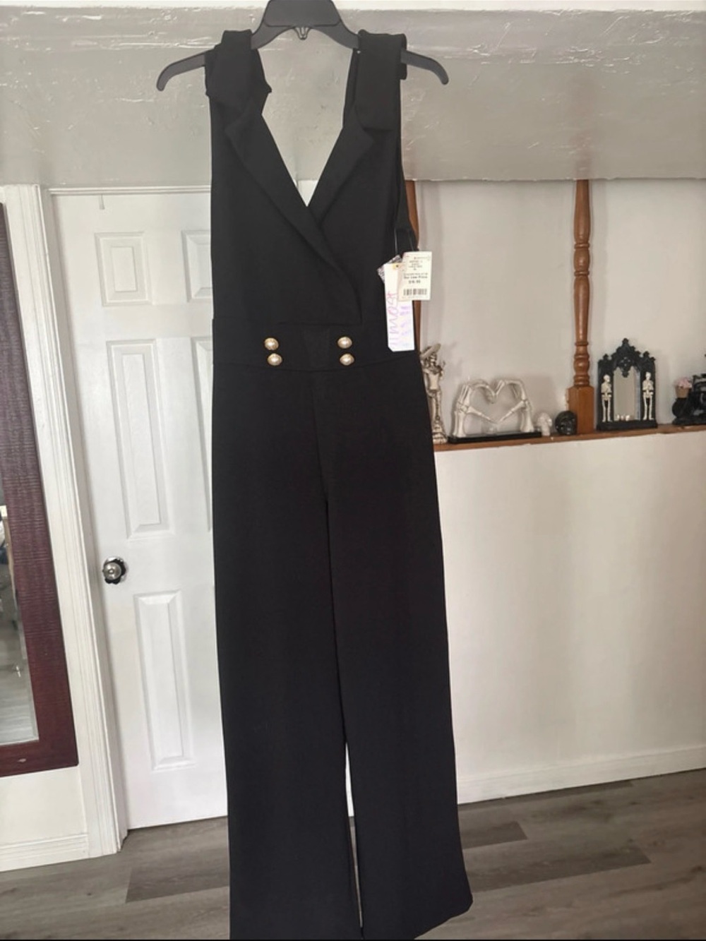 Sleeveless Wide-Leg Black Jumpsuit with Gold Button Detail